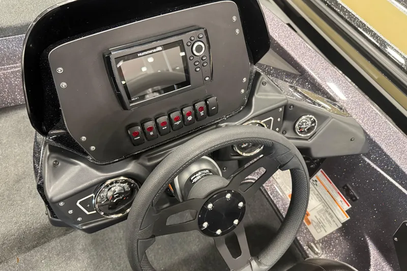 Slide: The Image of 2024 Skeeter ZX150 boat dashboard with steering wheel and electronic display. - 6