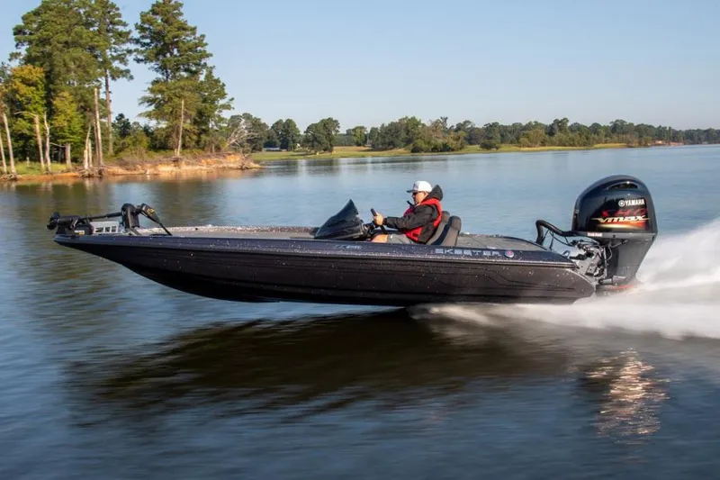 Slide: The Image of Manufacturer Provided Image: 2024 Skeeter ZX150 boat speeding on a lake with trees in the background. - 8