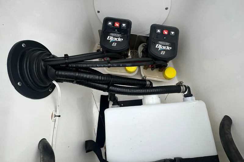 Slide: The Image of 2022 BlackJack 256 Bay boat wiring and hydraulic system components. - 6