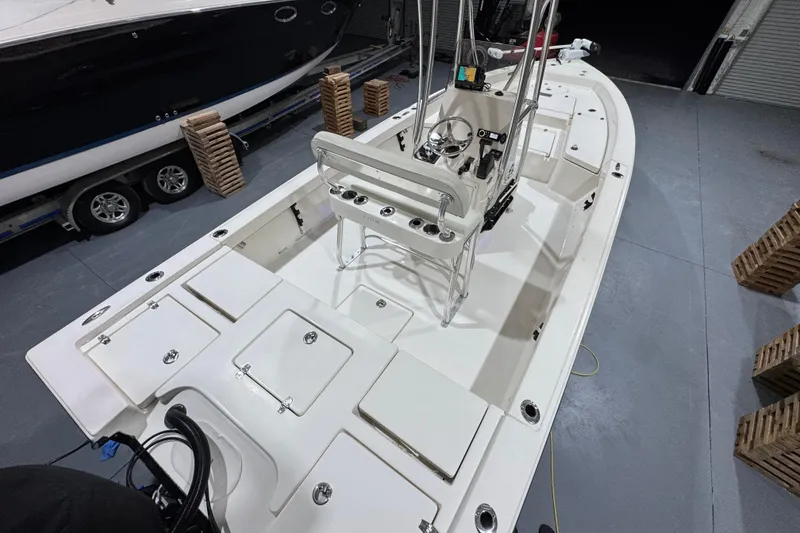 Slide: The Image of 2013 Pathfinder 2400 V boat interior with steering console and storage compartments. - 11