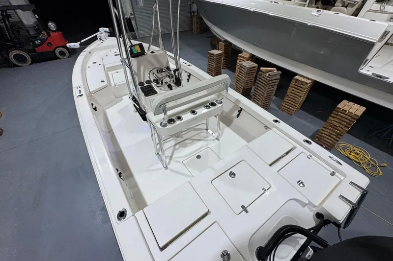 Slide: The Image of 2013 Pathfinder 2400 V boat interior with steering console and storage compartments. - 12