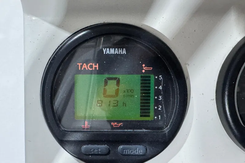 Slide: The Image of Yamaha tachometer displaying 813 hours on a 2013 Pathfinder 2400 V boat. - 18