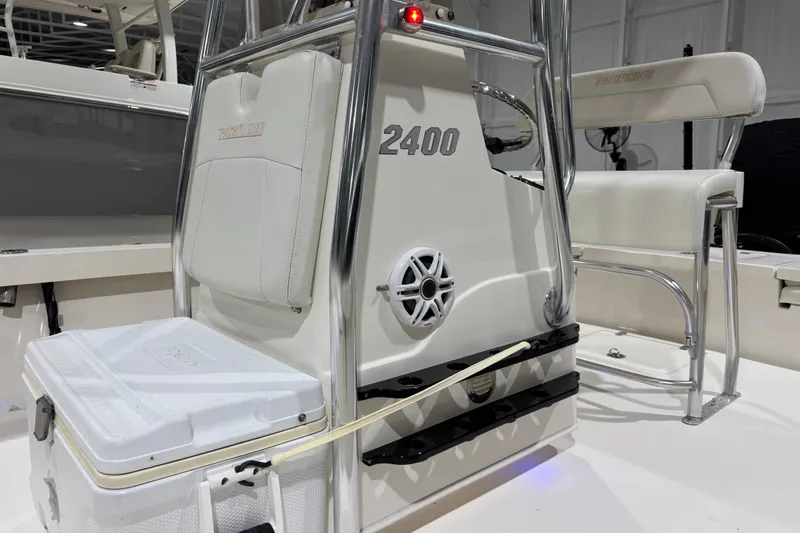 Slide: The Image of 2013 Pathfinder 2400 V boat interior with seating and storage cooler. - 21