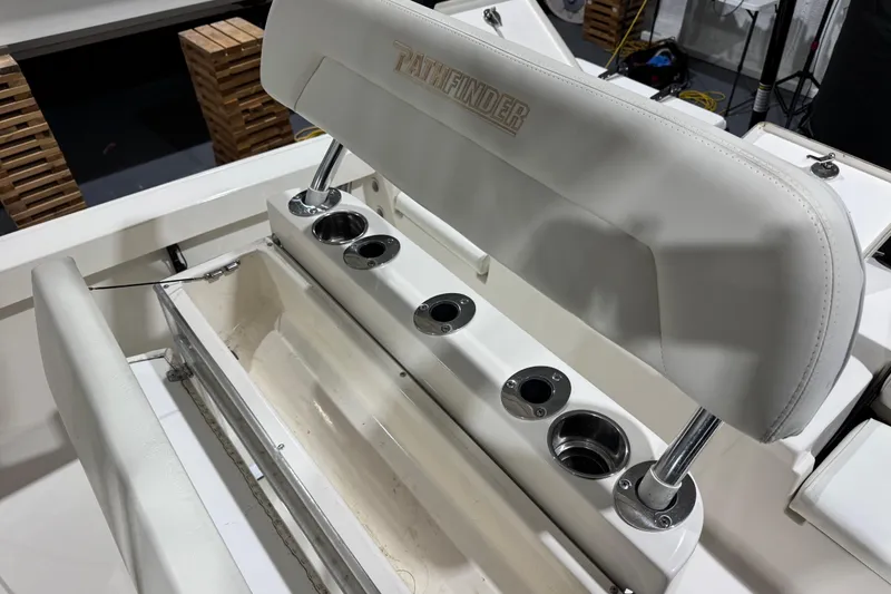 Slide: The Image of 2013 Pathfinder 2400 V boat seat with integrated cup holders and storage compartment. - 29