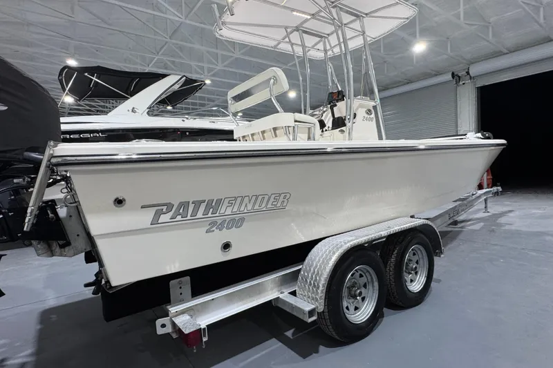 Slide: The Image of 2013 Pathfinder 2400 V boat on trailer in indoor storage facility. - 3