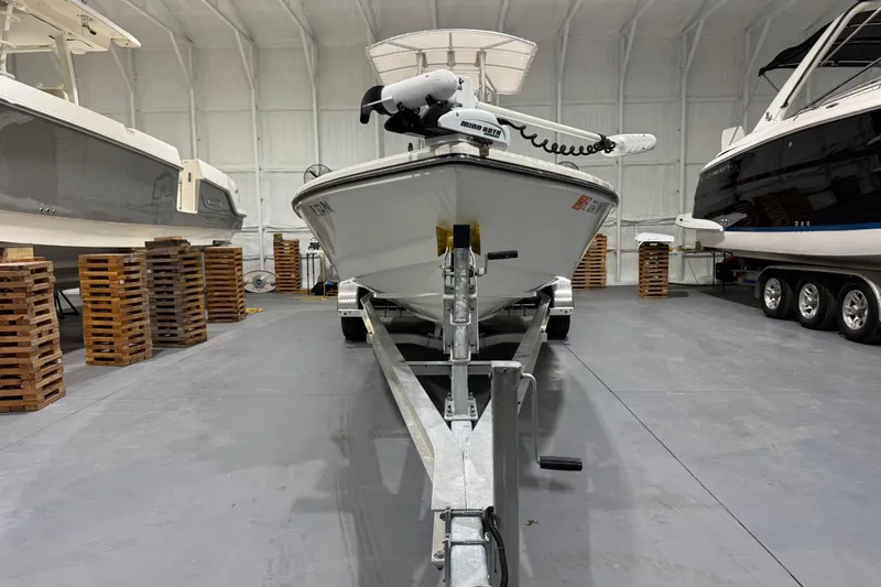 Slide: The Image of 2013 Pathfinder 2400 V boat on trailer in storage facility. - 4