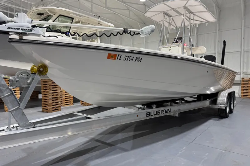 Slide: The Image of 2013 Pathfinder 2400 V boat on Bluefin trailer in indoor storage. - 9