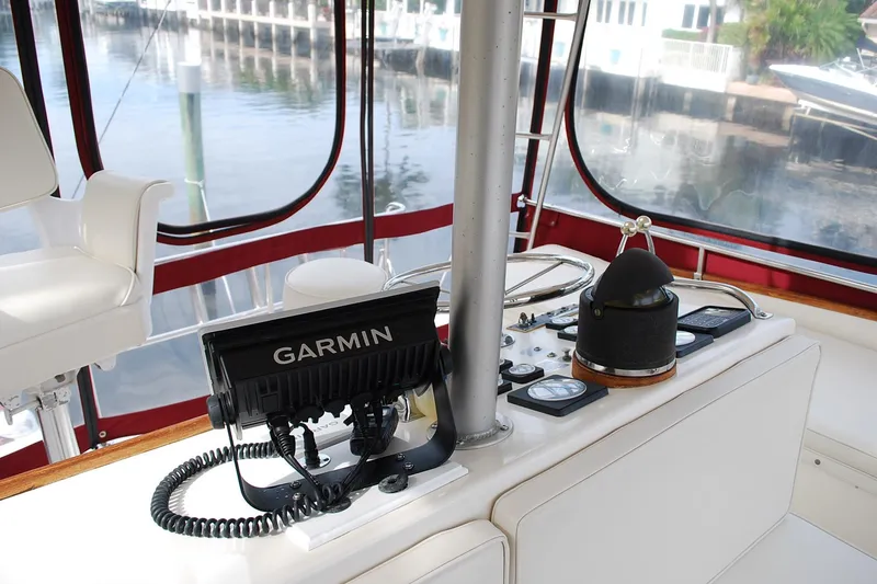 Slide: The Image of 1987 Jersey Dawn boat cockpit with Garmin navigation system and control panel. - 11