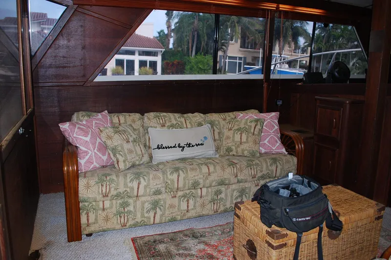 Slide: The Image of Interior of 1987 Jersey Dawn boat with tropical sofa and decorative pillows. - 13