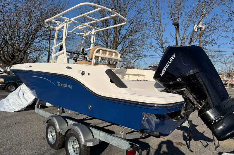 Slide: The Image of 2026 Bayliner Trophy T22CC boat on trailer with Mercury outboard motor. - 3