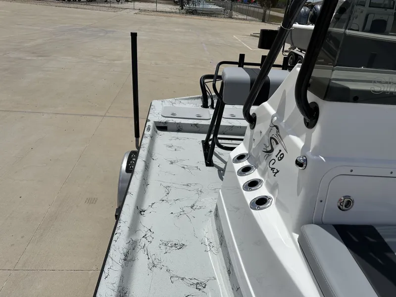 Slide: The Image of Shoalwater 19 CAT 2026 boat with sleek design on parking lot. - 23