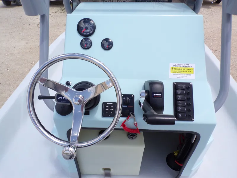Slide: The Image of 2026 Shoalwater 20' Catamaran helm with Yamaha controls. - 25