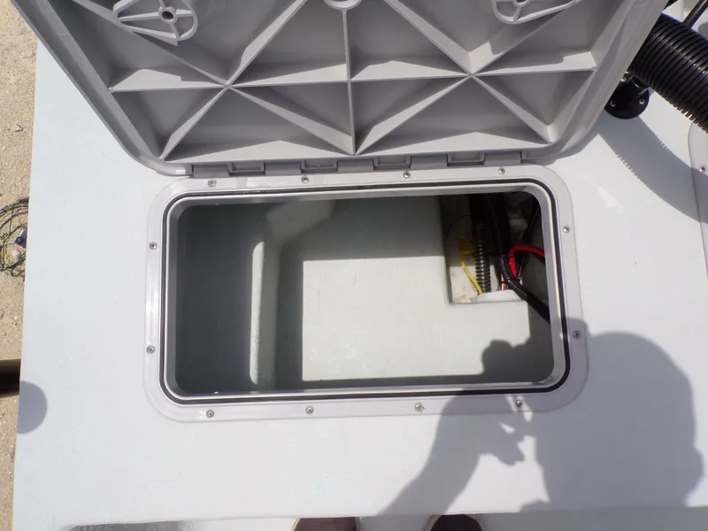 Slide: The Image of Open storage compartment on a 2026 Shoalwater 20' Catamaran. - 28