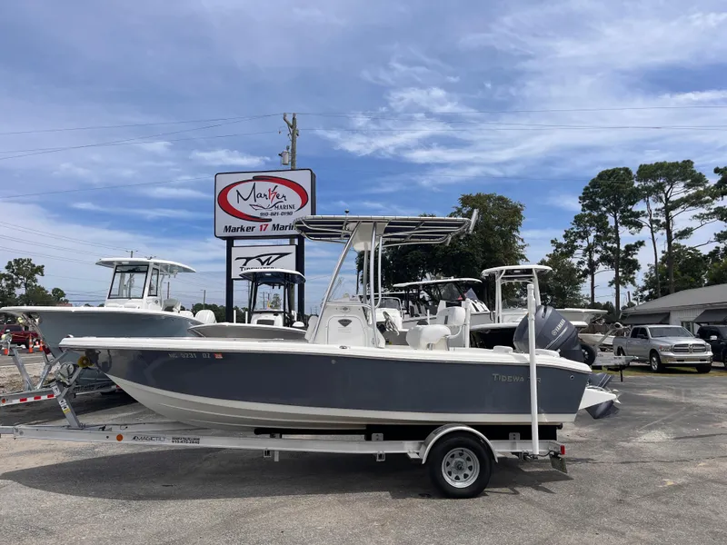 The Image of 2014 Tidewater 196 CC Adventure boat on trailer outdoors. - 0