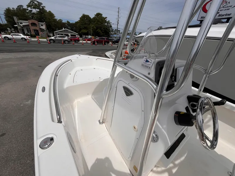 Slide: The Image of 2014 Tidewater 196 CC Adventure boat in a parking lot. - 10