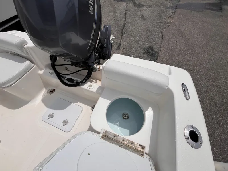 Slide: The Image of 2014 Tidewater 196 CC Adventure boat stern with motor and storage. - 13