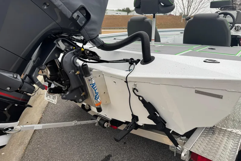 Slide: The Image of 2026 Xpress H20 Bass boat rear view with motor and trailer attachment. - 14