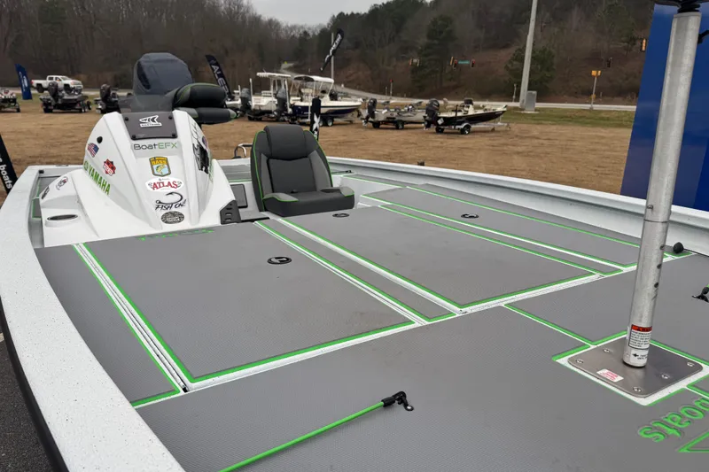 Slide: The Image of 2026 Xpress H20 Bass boat with sleek deck design and Yamaha branding. - 9