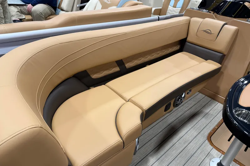 Slide: The Image of Luxurious tan seating on 2026 SunCatcher Fusion 324RC boat, featuring sleek design and comfort. - 2
