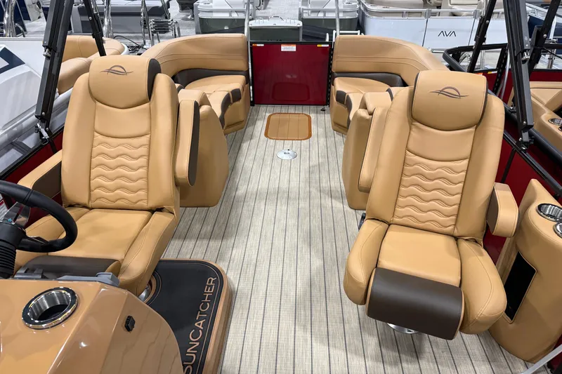 Slide: The Image of Luxurious interior of 2026 SunCatcher Fusion 324RC boat with tan leather seating. - 4