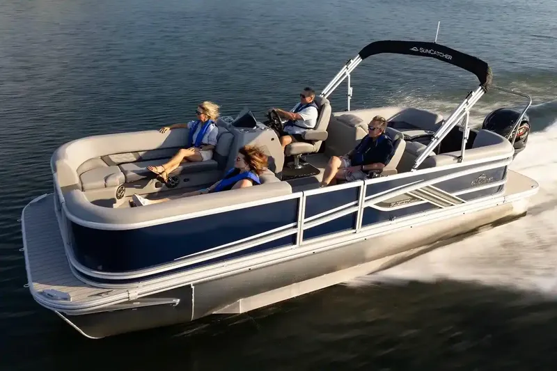 Slide: The Image of Manufacturer Provided Image: 2026 SunCatcher Fusion 324RC pontoon boat cruising on water with passengers enjoying the ride. - 9