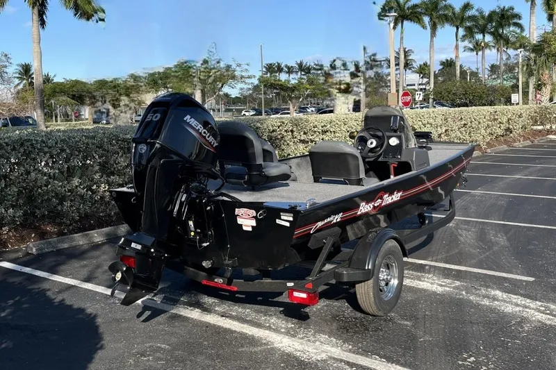 Slide: The Image of 2026 Tracker Bass Tracker Classic XL boat in parking lot, featuring Mercury engine. - 11