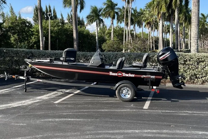 Slide: The Image of 2026 Tracker Bass Tracker Classic XL boat on trailer, parked outdoors. - 16