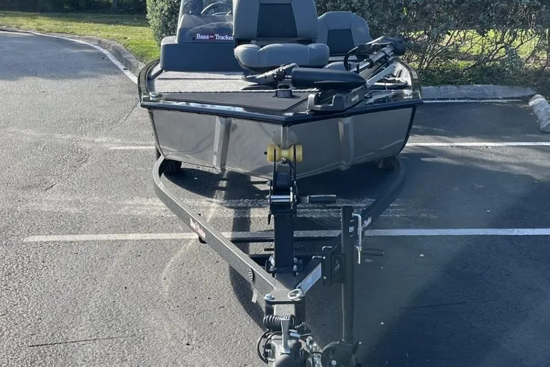 Slide: The Image of 2026 Tracker Bass Tracker Classic XL boat on trailer in parking lot. - 2