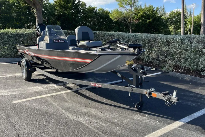 Slide: The Image of 2026 Tracker Bass Tracker Classic XL boat on trailer in parking lot. - 4