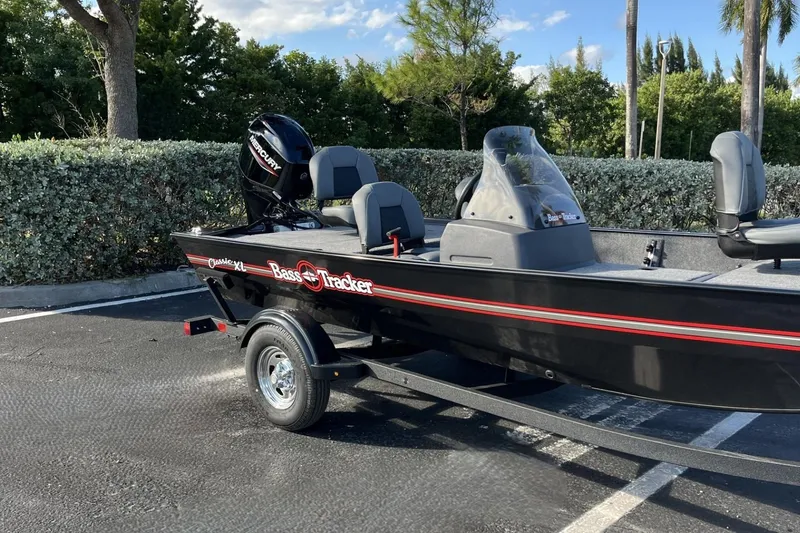 Slide: The Image of 2026 Tracker Bass Tracker Classic XL boat parked outdoors on a trailer. - 63