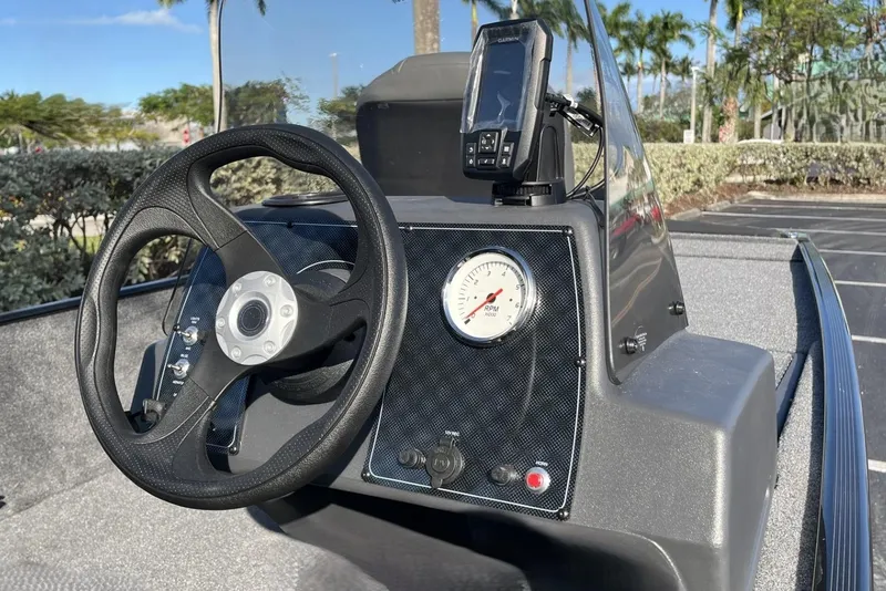 Slide: The Image of Steering console of 2026 Tracker Bass Tracker Classic XL boat with RPM gauge and GPS device. - 7