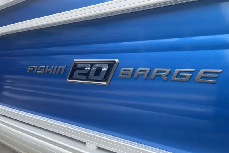 Slide: The Image of 2026 Sun Tracker Fishin' Barge 20 DLX logo on blue background. - 104