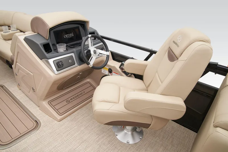 Slide: The Image of 2025 Regency 230 LE3 pontoon boat interior with plush seating and modern helm. - 18