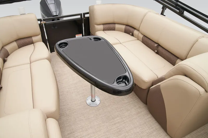 Slide: The Image of 2025 Regency 230 LE3 pontoon boat interior with plush seating and modern design. - 26