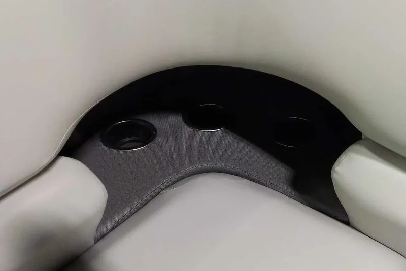 Slide: The Image of 2026 Sun Tracker Fishin' Barge 22 XP3 interior cup holders and seating detail. - 117