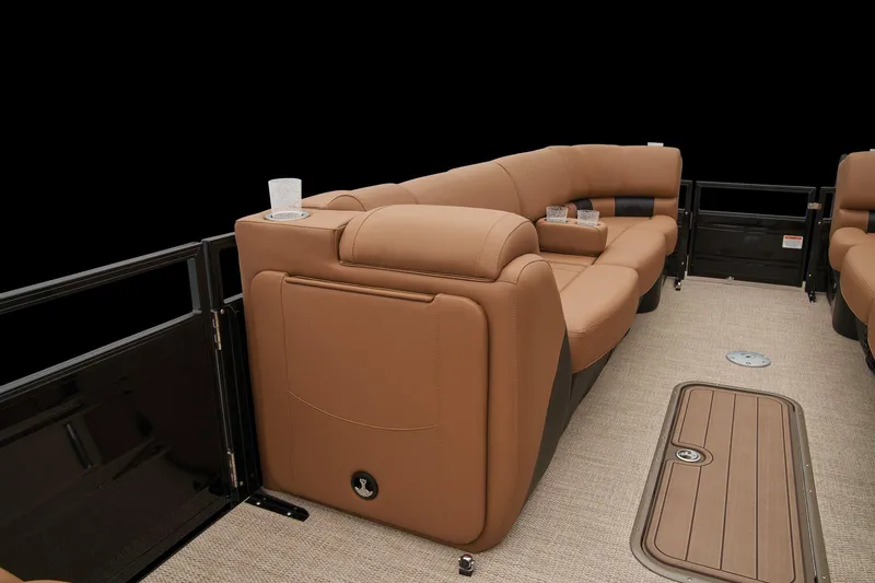 Slide: The Image of 2025 Regency 250 LE3 boat interior with plush gray seating and storage compartment. - 25