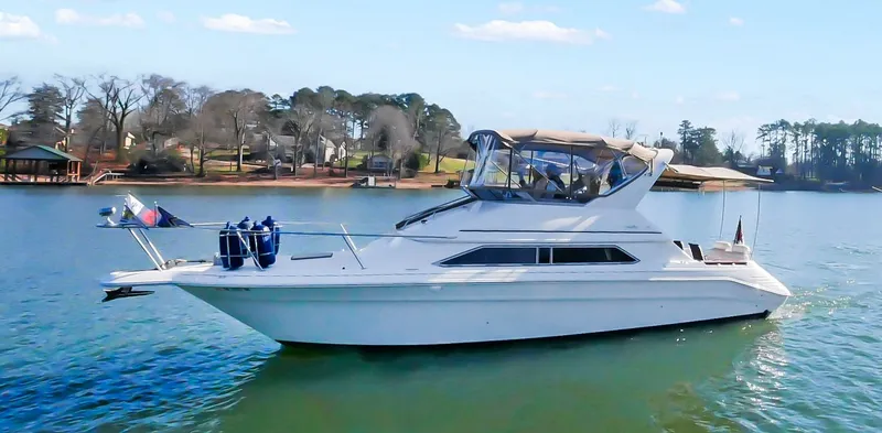 The Image of 1993 Sea Ray Express Bridge 350 on calm water. - 0