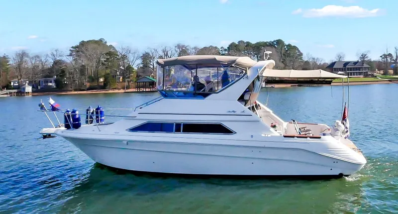 Slide: The Image of 1993 Sea Ray Express Bridge 350 on a tranquil lake. - 1
