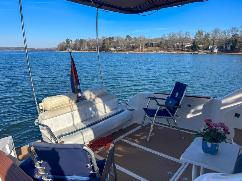 Slide: The Image of Deck of 1993 Sea Ray Express Bridge 350 with lake view. - 15