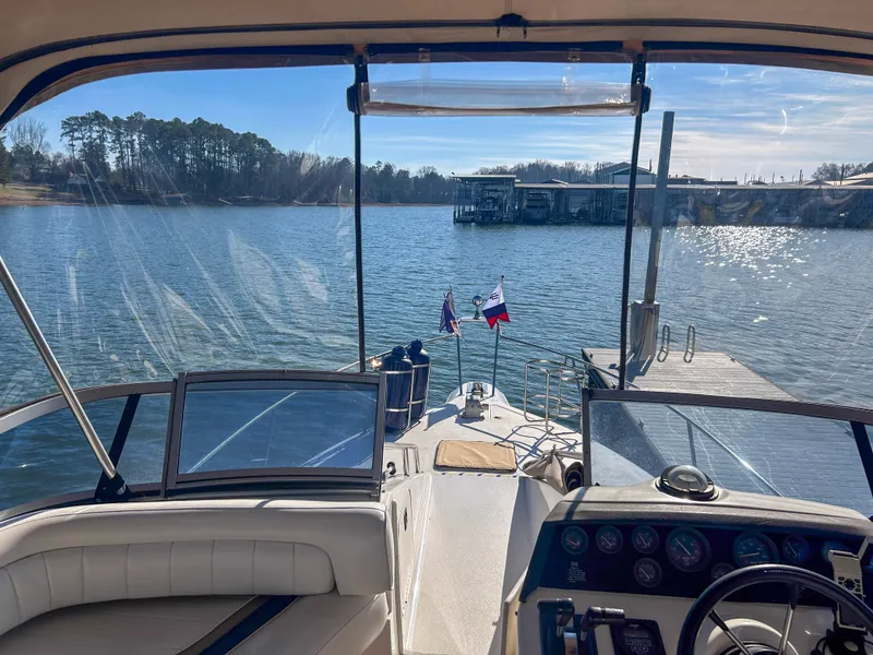 Slide: The Image of Interior view of a 1993 Sea Ray Express Bridge 350 on a lake. - 17