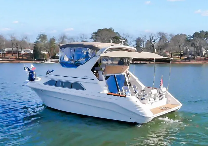 Slide: The Image of 1993 Sea Ray Express Bridge 350 on a tranquil lake. - 2