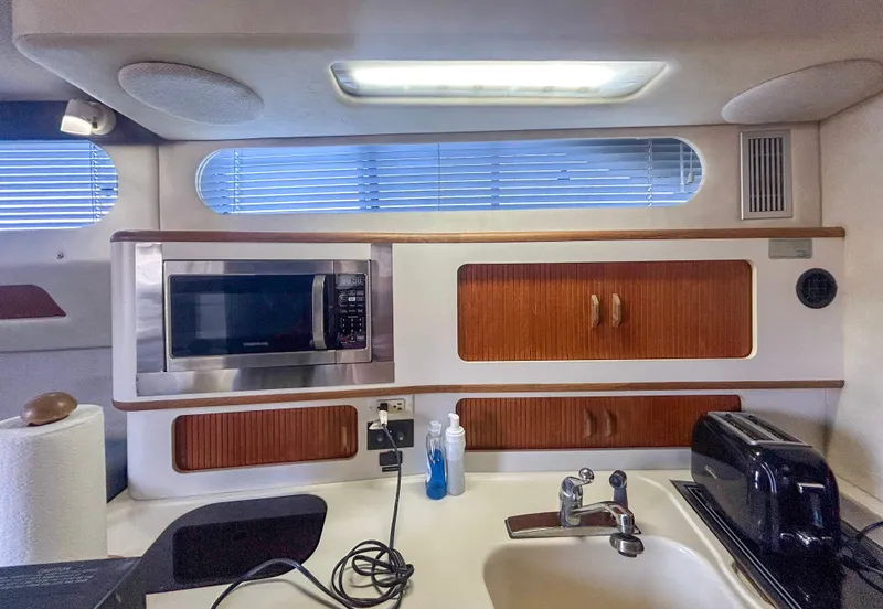 Slide: The Image of 1993 Sea Ray Express Bridge 350 kitchen area with microwave. - 24