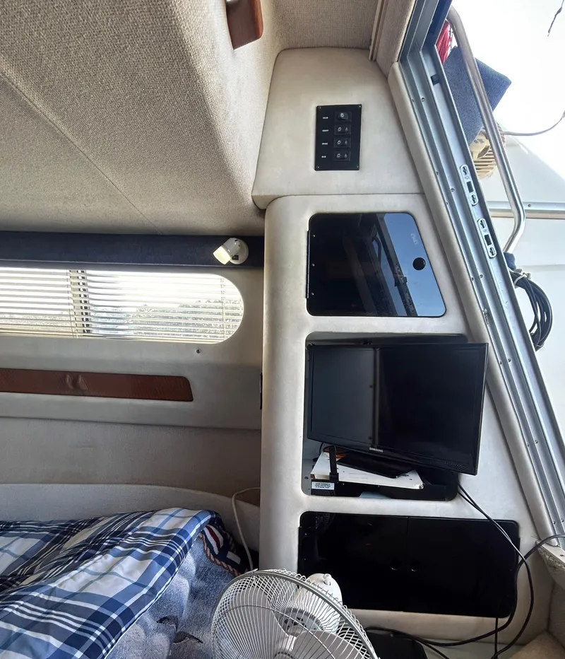 Slide: The Image of Interior of a 1993 Sea Ray Express Bridge 350 with bed and TV. - 29