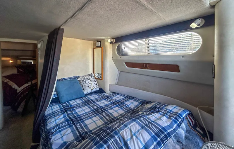 Slide: The Image of Interior of 1993 Sea Ray Express Bridge 350 yacht with cozy bed. - 32