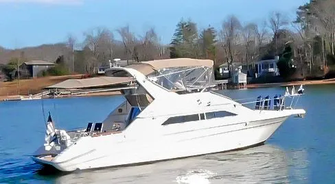 Slide: The Image of 1993 Sea Ray Express Bridge 350 on calm water. - 7