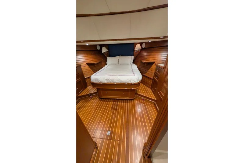 Slide: The Image of Luxurious cabin interior of 2004 Grand Banks 58 Eastbay FB yacht with wooden finishes. - 16