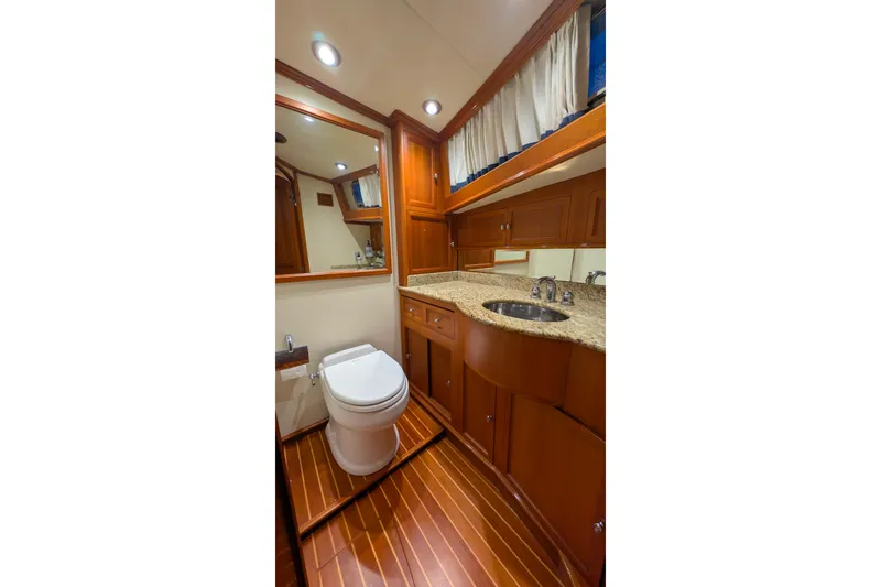 Slide: The Image of Luxurious 2004 Grand Banks 58 Eastbay FB yacht bathroom with wood accents and granite countertop. - 29