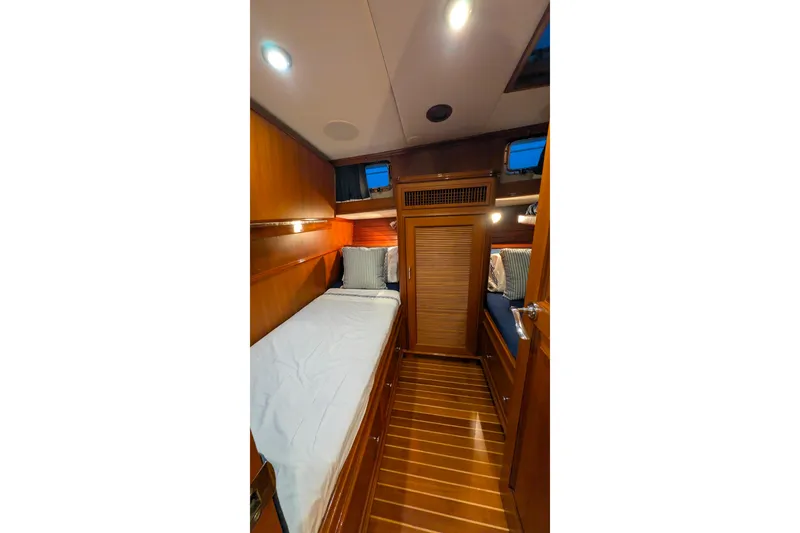 Slide: The Image of Luxurious cabin interior of 2004 Grand Banks 58 Eastbay FB yacht with wooden finishes. - 30