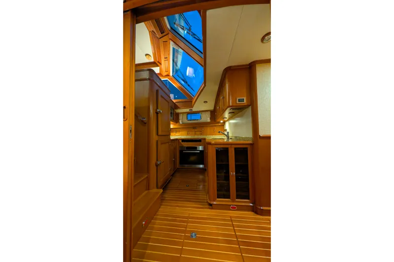 Slide: The Image of Interior of 2004 Grand Banks 58 Eastbay FB yacht with wooden cabinetry and skylight. - 31