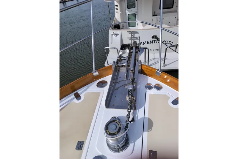 Slide: The Image of Bow of 2004 Grand Banks 58 Eastbay FB yacht with anchor chain and winch. - 39